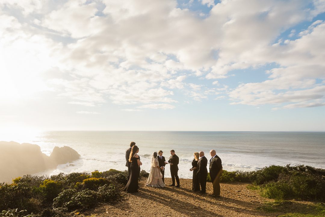 Bride and groom clifftop wedding ceremony on Algarve west coast, Portugal wedding photographer