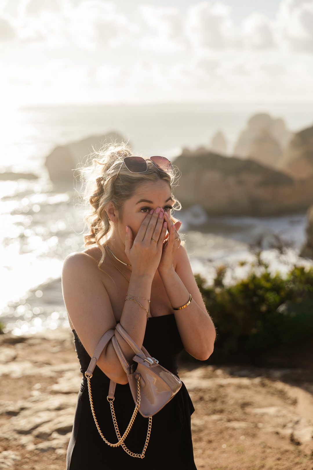Emotional surprise proposal photographed on the Algarve coastline at sunset 