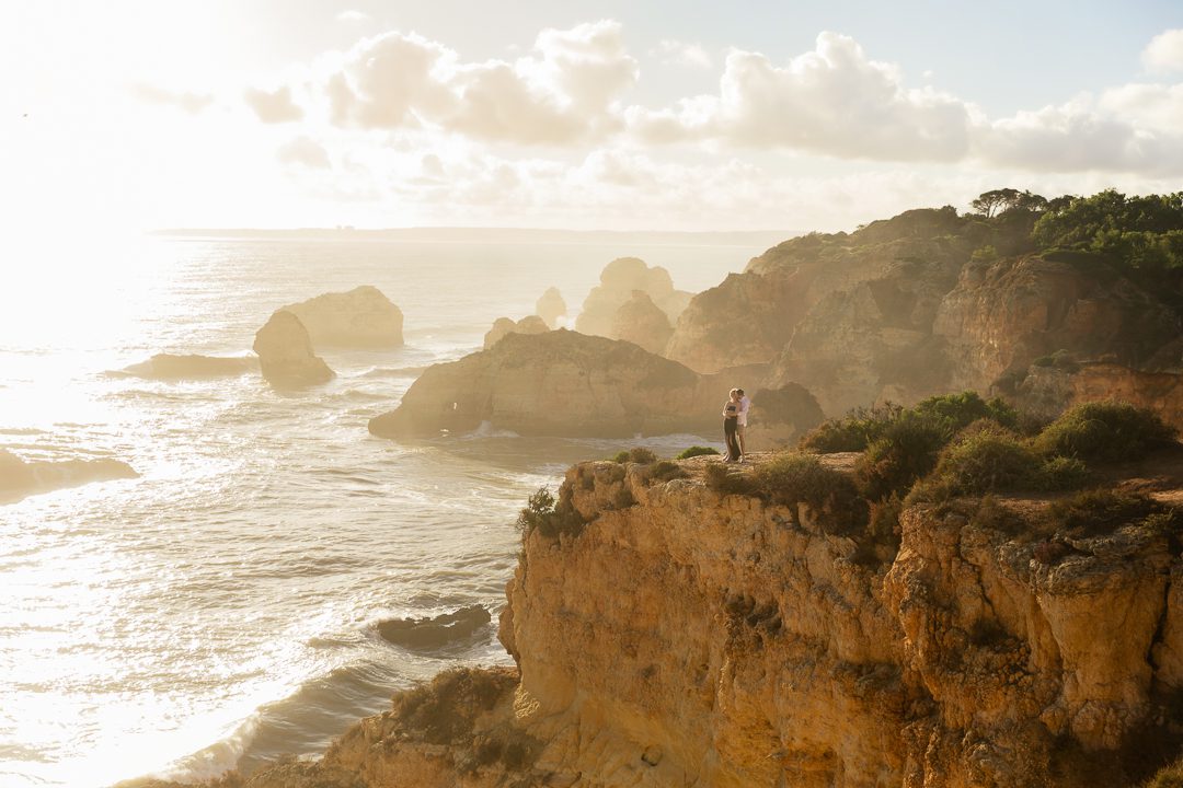 Golden Algarve cliffs and Atlantic Ocean backdrop during a destination engagement proposal 
