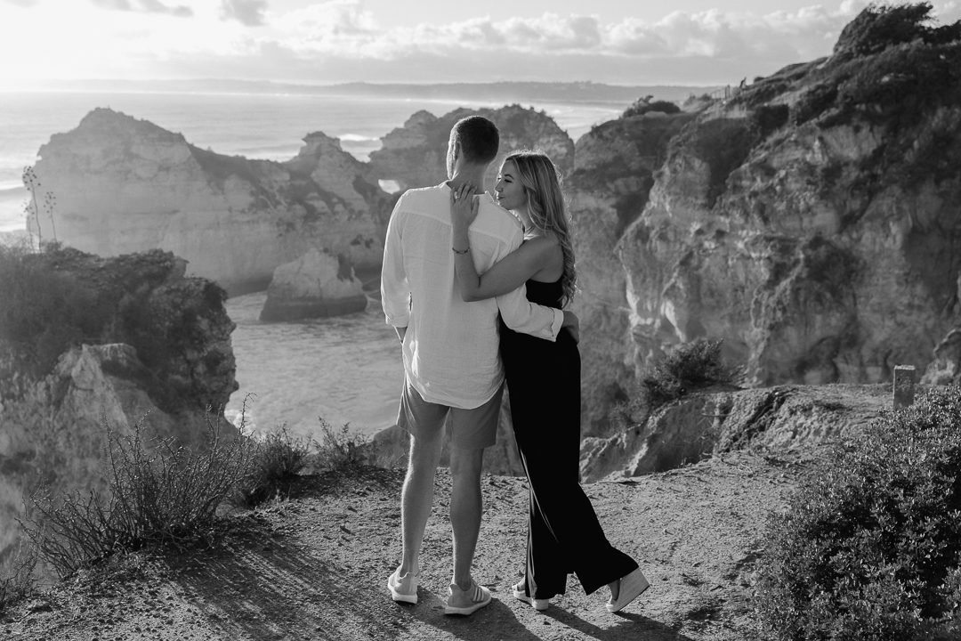 Emotional surprise proposal photographed on the Algarve coastline at sunset 