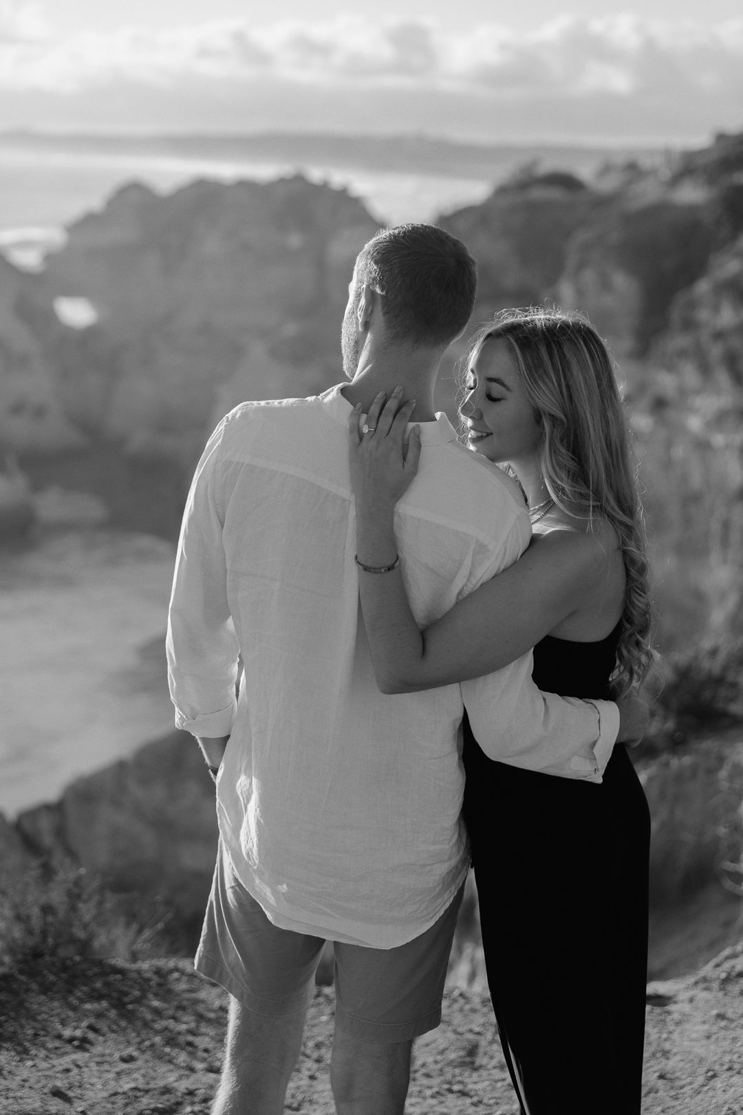 Emotional surprise proposal photographed on the Algarve coastline at sunset 