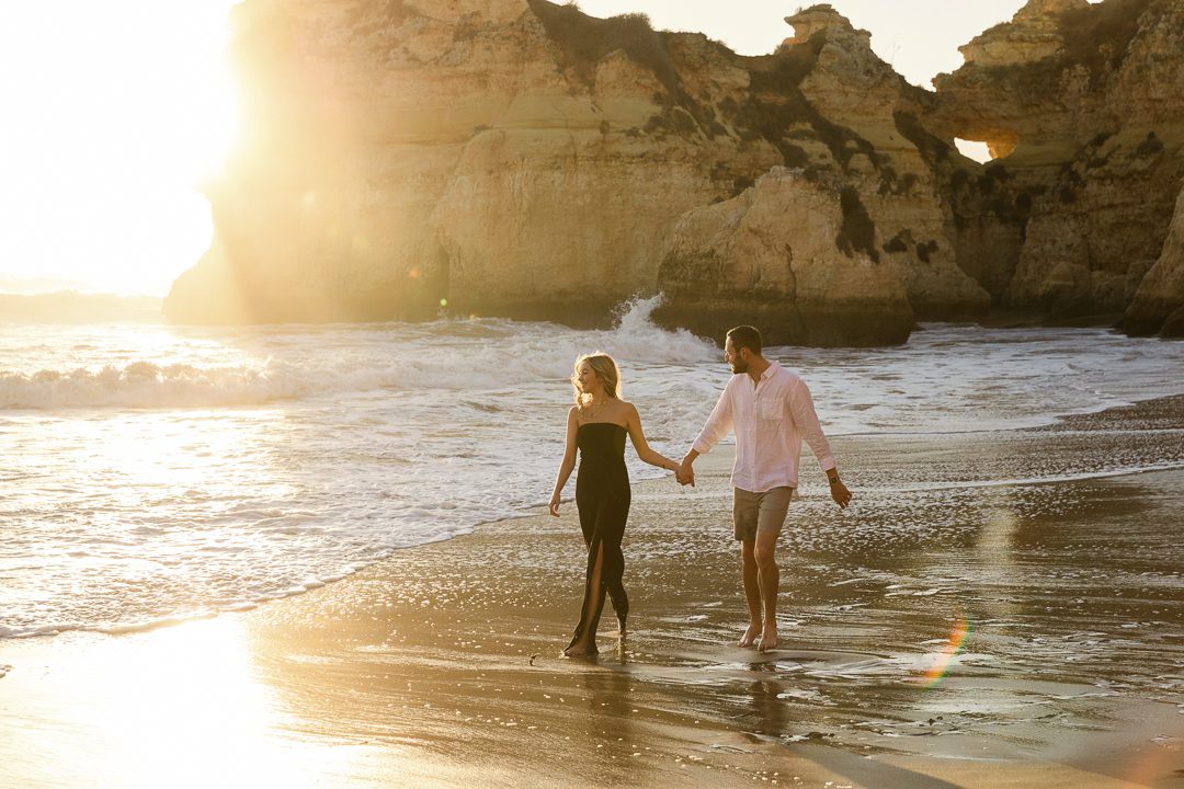 Playful beach engagement session in the Algarve after a surprise proposal 