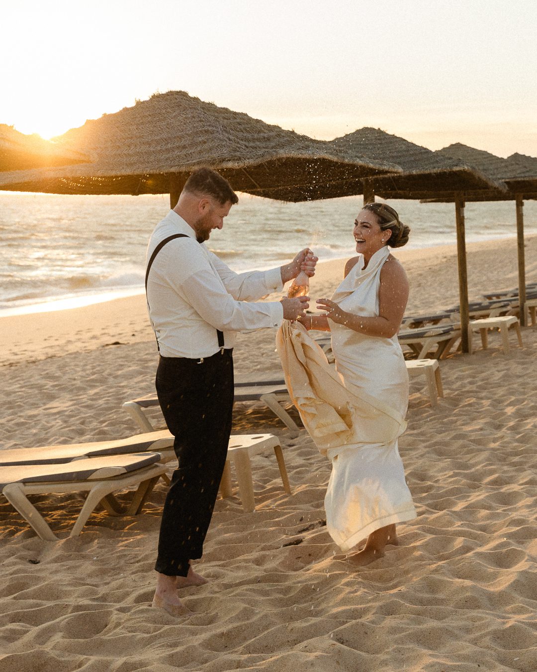destination elopement in Portugal, bride and groom on the beach in Portugal, Palace wedding in Portugal, Wedding photography Portugal, Algarve wedding, Portugal elopement, champaign pop moment