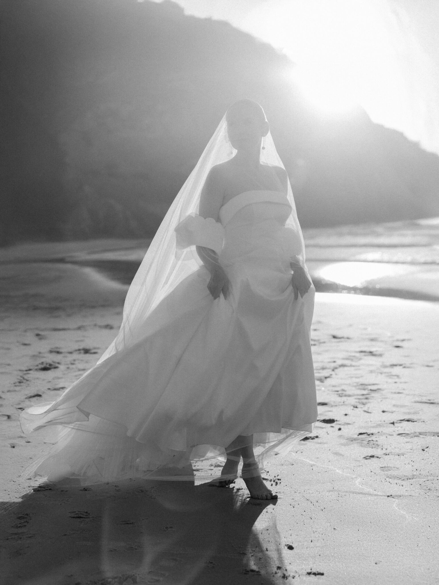 Bride in a romantic dramatic vail and bridal gown
