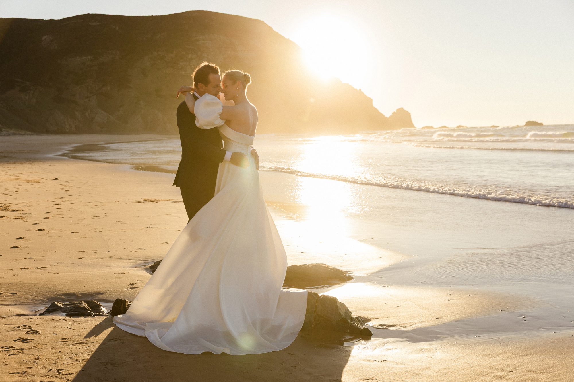 Bride and groom exploring the west coast of the Algarve at golden hour
