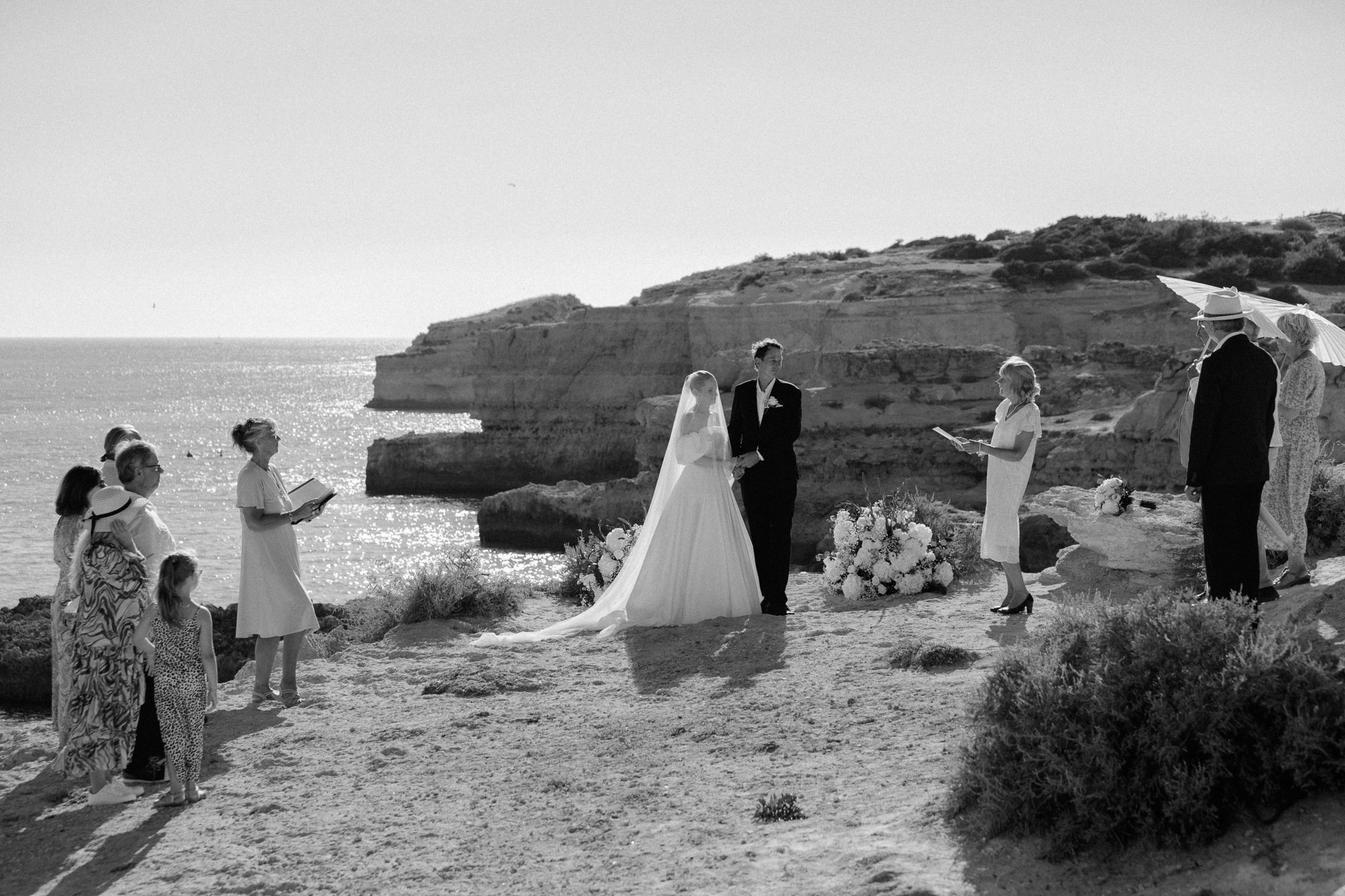 Bride and groom during an intimate clifftop ceremony in the Algarve, Portugal
