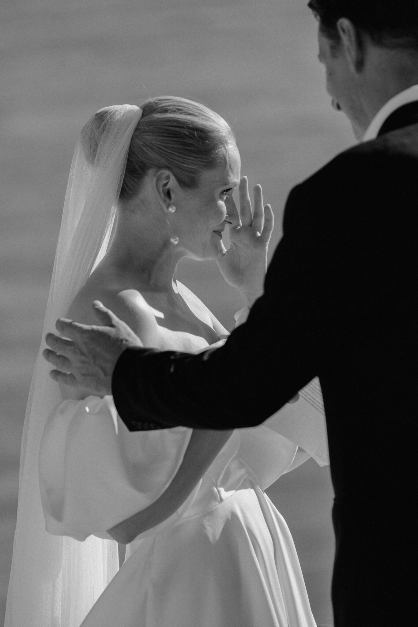Bride in a romantic wedding gown and vail during an Algarve elopement ceremony
