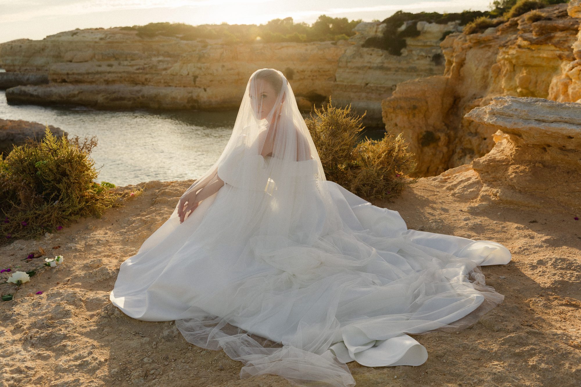 Bride in a romantic wedding gown and vail during an Algarve elopement ceremony
